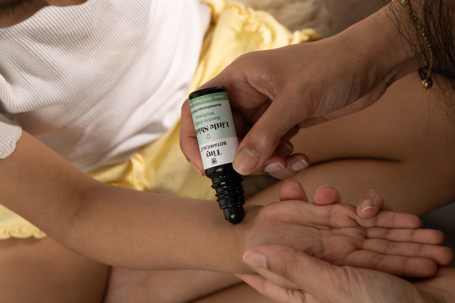 Little Shield roll-on applied to a child’s wrist