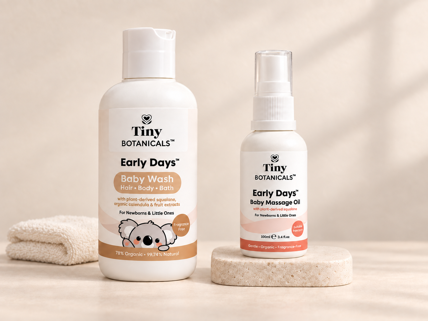 Early Days Baby Wash and Baby Massage Oil on a warm ivory background