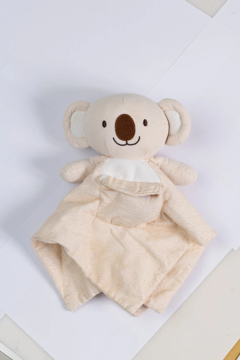 Koa Comfy comfort companion laid out with its removable heart